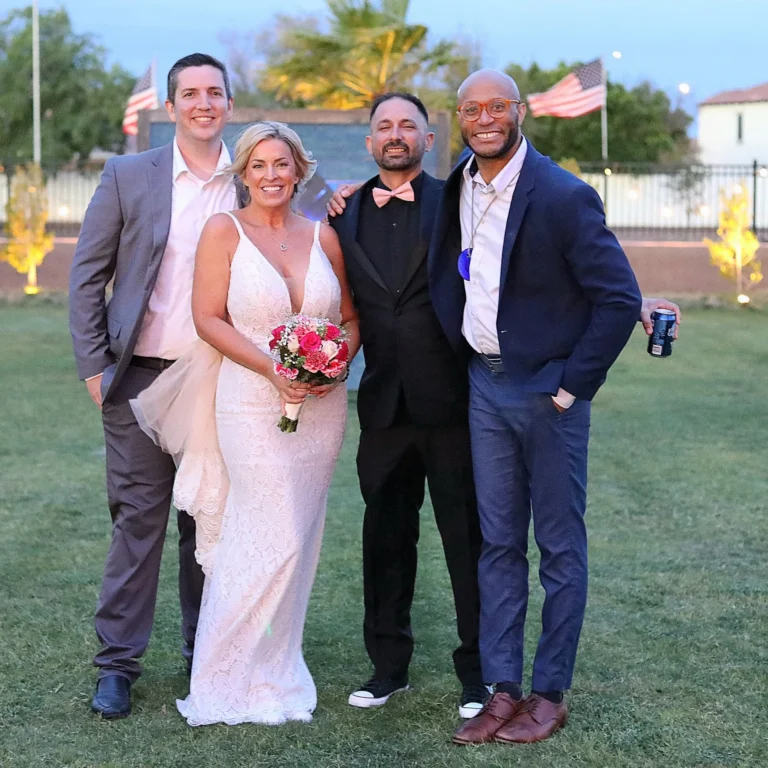 Hype Man Entertainment hosts standing with the bride and groom on the lawn at an outdoor wedding