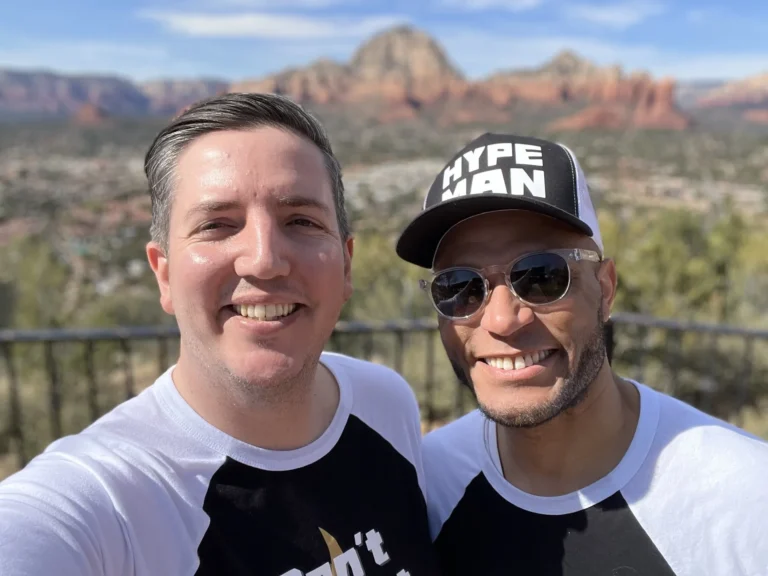 Kelvin and Taylor of Hype Man Entertainment in Hype Man caps with the Sedona red rocks behind them