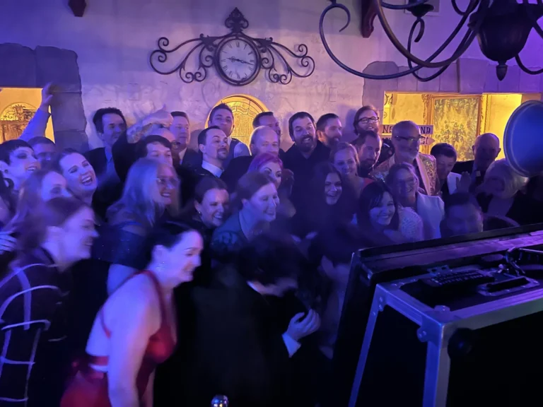 Wedding guests packed onto the dance floor with their hands in the air during a Hype Man Entertainment reception