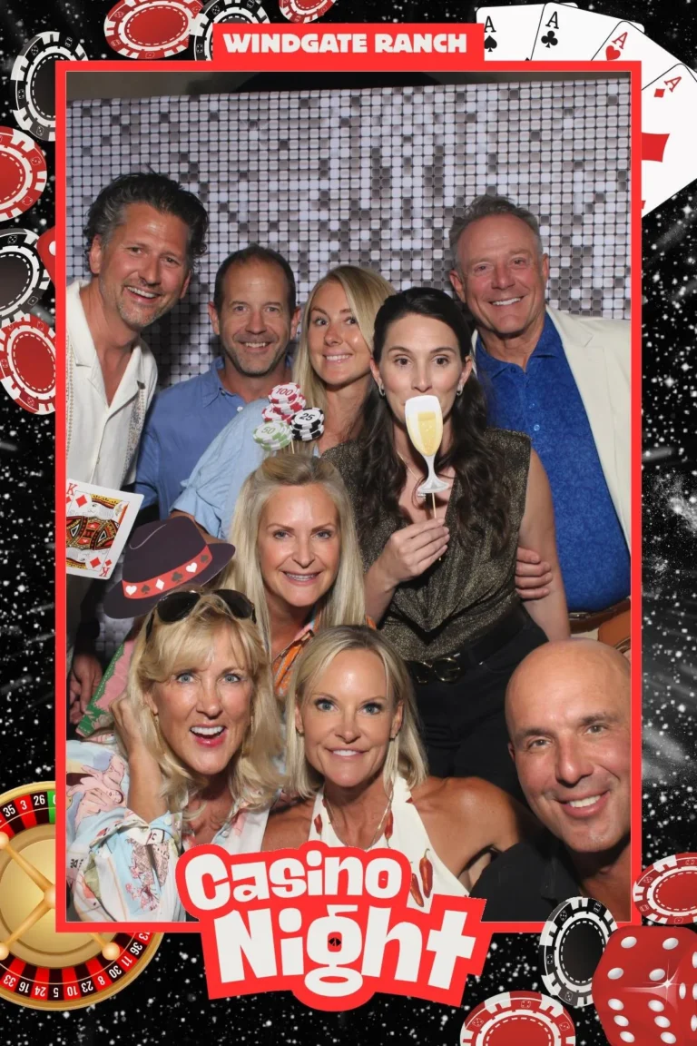 Photo booth print of guests in a casino night template with playing card artwork