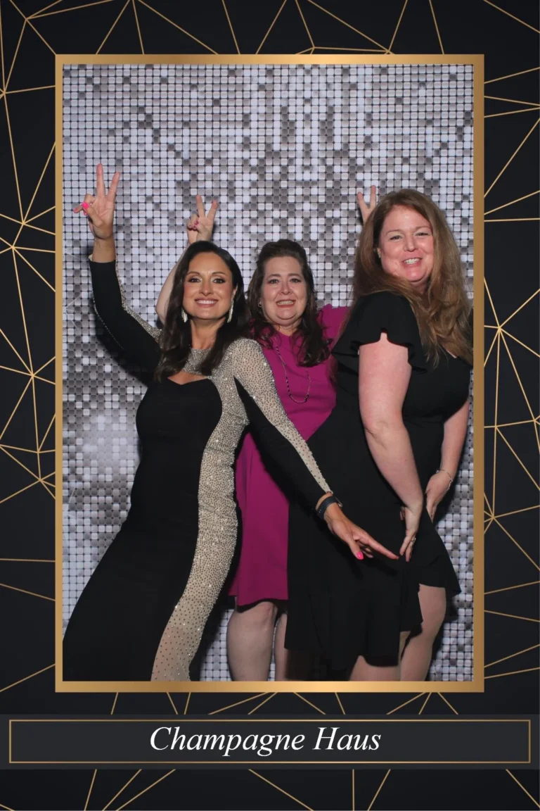 Photo booth print of guests celebrating in a Champagne Haus branded template