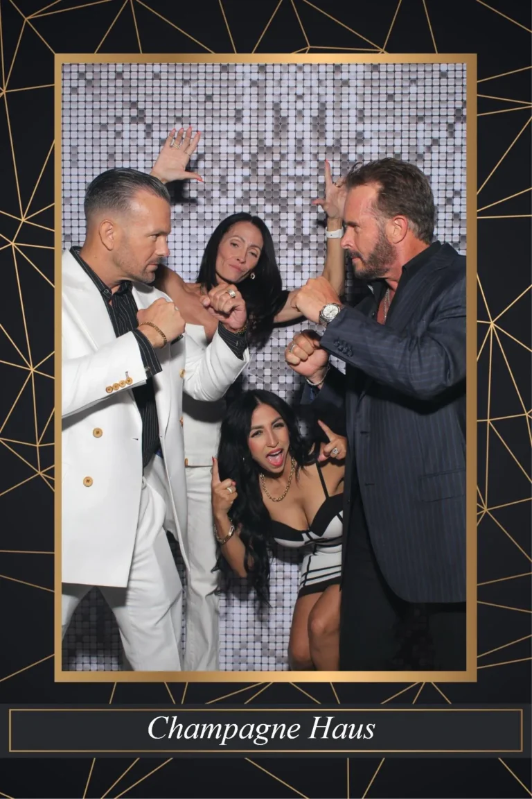 Photo booth print of corporate event guests posing in a gold frame template