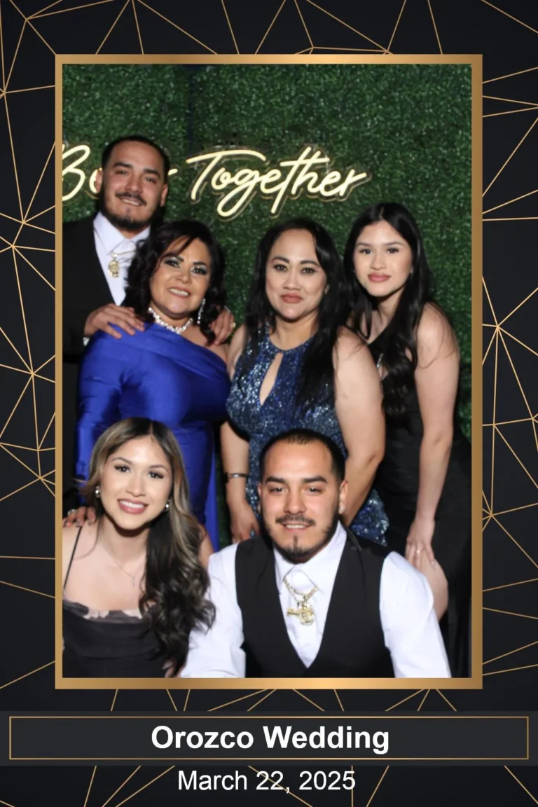 Photo booth print of wedding guests in a gold frame template with the couple&rsquo;s name and date